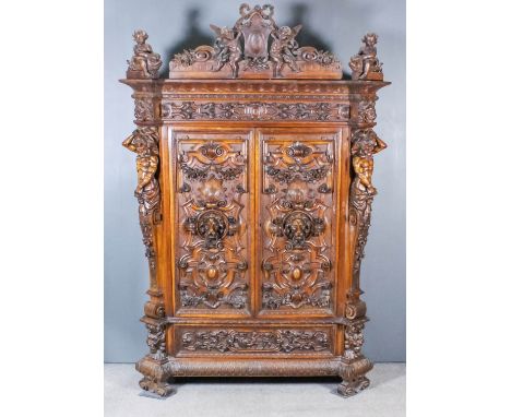 A Good 19th Century Venetian Walnut Armoire of "Renaissance" design, by Pauly &amp; Cie of Venice, the whole boldly carved wi