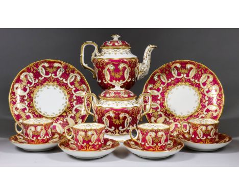 A Davenport Porcelain Part Tea Service, circa 1850, with gilt decoration on a claret ground, pattern No. 2439, with printed f