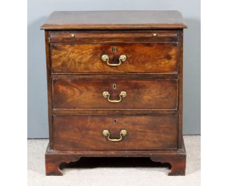 A George III Mahogany Chest of Small Proportions, with moulded edge to top, fitted with a brushing slide and three long drawe