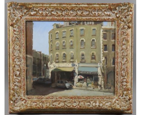***Ken Moroney (born 1949) - Oil painting - South London street scene with cars parked in front of shops, signed in red to lo