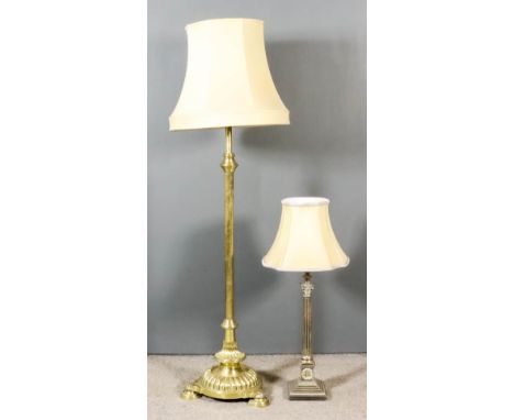 A Brass Telescopic Standard Lamp, Victorian, on reeded central column, conforming circular base and bun feet, 53ins high, and