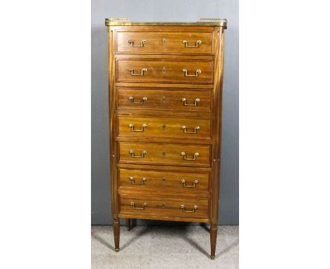 A Late 19th Century French Mahogany Semainier, the top with pierced brass gallery enclosing white marble panel, fitted seven 