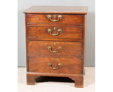 A Late George III Mahogany Beside Commode, the upper part with twin dummy drawer front, the former commode drawer under with 