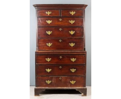 A George III Mahogany Tallboy, the upper part with moulded cornice, fitted two short and three long drawers and with fluted c