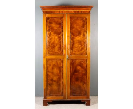 A 19th Century Mahogany Wardrobe of "Georgian" Design, inlaid with rosewood bandings and boxwood stringings, the upper part w