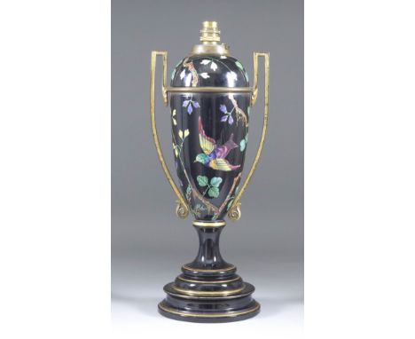 A Gilt Metal Mounted English Pottery Oil Lamp, Late 19th Century, enamelled with bird and butterfly amongst flowering stems o