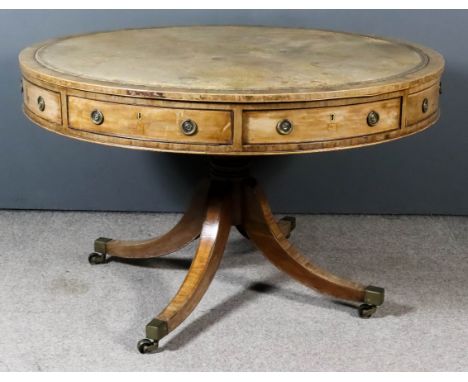 A George III Mahogany Circular Drum Table, the top inset with tooled leather central panel within crossbanded border, the apr