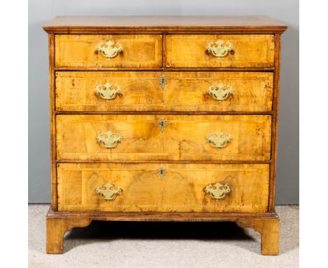 An 18th Century Walnut Chest, the top and drawer fronts inlaid with herringbone bandings and the top crossbanded, fitted two 