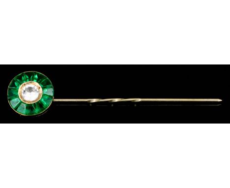 A Diamond and Emerald Stick Pin, in gold coloured metal mount, the circular terminal set with a central round brilliant cut s