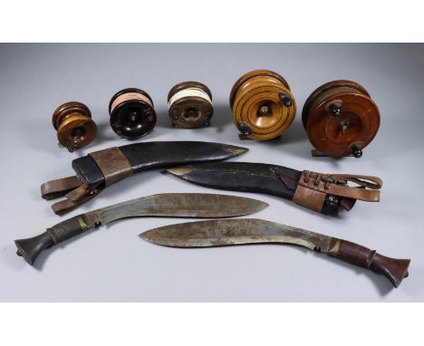 A Kukri Knife, 20th Century, 10ins plain steel blade with fuller, hardwood grip, in leather and brass scabbard, 14ins overall
