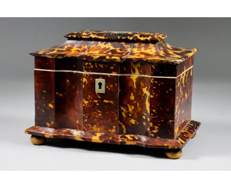 An Early Victorian Tortoiseshell Rectangular Tea Caddy, the whole of shaped outline, the interior with two lidded compartment