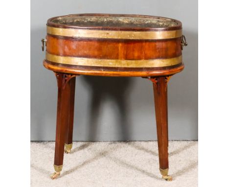 A Mahogany and Brass Bound Oval Two-Handled Planter of "18th Century" design, the coopered sides with heavy brass bands and r