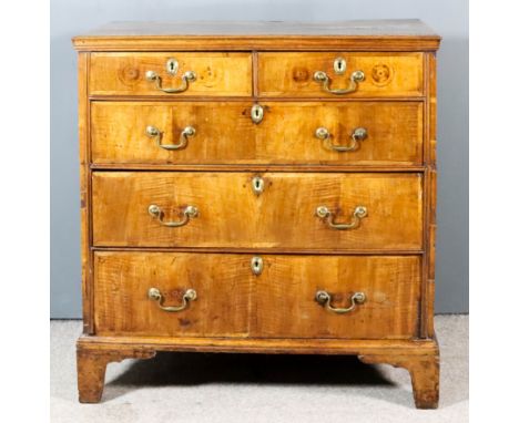 An 18th Century Provincial Walnut and Grained Wood Sided Chest, with three-plank top and moulded edge, fitted two short and t