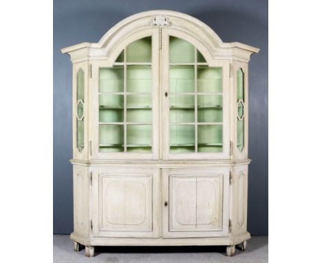 A 19th Century Dutch Panelled Limed Oak Display Armoire of "17th/18th Century" Design, the upper part with deep arched and mo