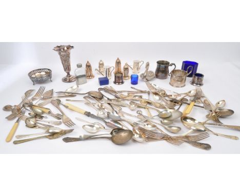 An assortment of vintage 20th Century silver plate cutlery items. Including; forks, knives, napkin holders, tea spoons, spoon
