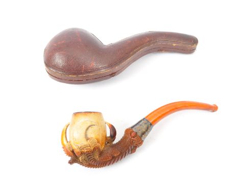 An early 20th century&nbsp;meerschaum tobacco pipe carved in the form of a dragon claws holding bowl. The stem being formed o