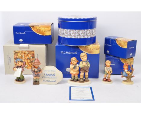 Hummel Goebel - A collection of NOS New Old Stock boxed German Hummel Goebel figurines to include Dealer Plaque, Big Announce