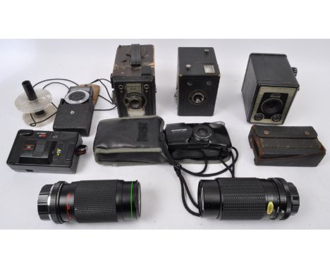 A collection of vintage 20th Century cameras and camera lenses. Comprising of Conway camera, Brownie six-20, Hanimex HMC lens