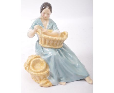A vintage 20th century circa 1960s Royal Doulton fine bone china figurine of 'The Basket Weaver' HN 2245. It measures approx.