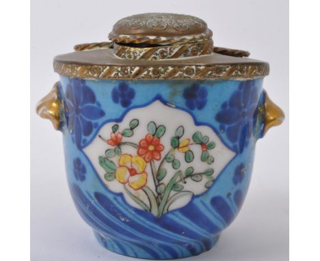 An early 20th century French porcelain and gilt metal desk top pot having metal lid with inkwell and ceramic monogram and bei