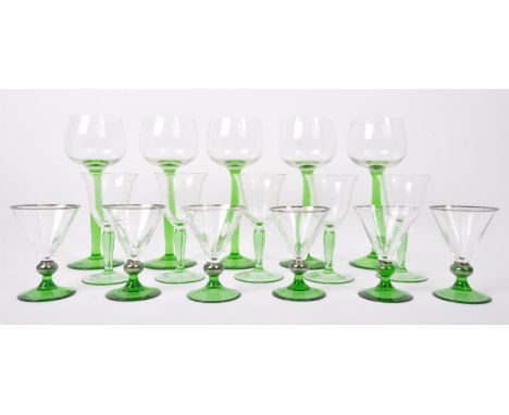 An assortment of vintage retro mid 20th century emerald and clear drinking glasses to include a set of Art Deco glasses of co