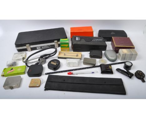 A large collection of vintage medical doctors / opticians equipment to include lenses, glasses, instruments, syringes, thermo