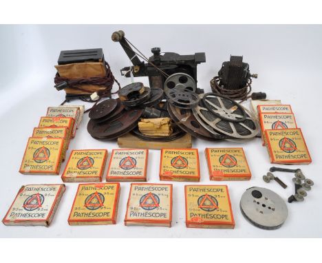 Pathescope Ace 9.5mm reel to reel player, made in England. With accompanying reels including; Fort Robinson Crusoe, The Turki
