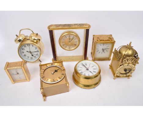 An assortment of retro vintage 20th century brass desk clocks &amp; alarm clocks. The lot to include a Timemaster marine time