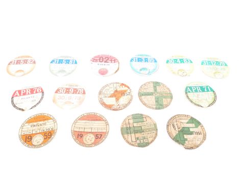 Motorabilia Interest - A collection of approximately thirty-six vintage tax discs ranging from the 1940s to the 2000's. Measu