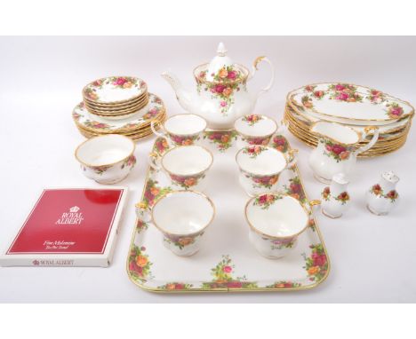 A vintage 20th century circa 1960s Royal Albert 'Old Country Roses' tea service. The set comprising tea pot, cups &amp; sauce