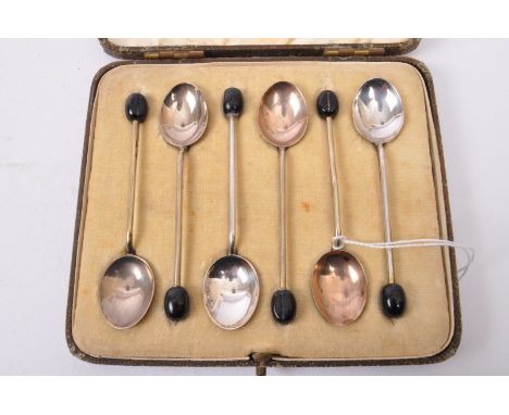A set of six vintage 20th century circa. 1940's enamelled silver plate coffee spoons. Each having guilloche enamelled backs a