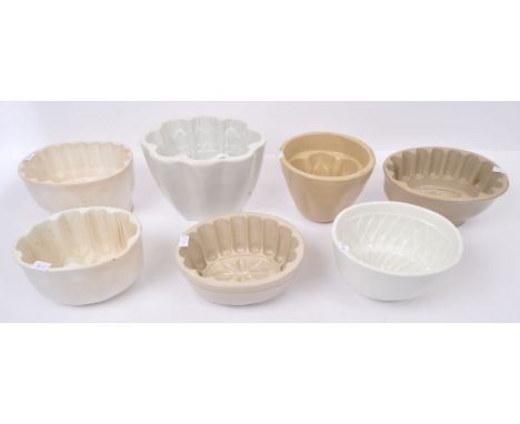 A collection of seven 19th century late Victorian and later 20th century china ceramic jelly moulds in a variety of patterns 