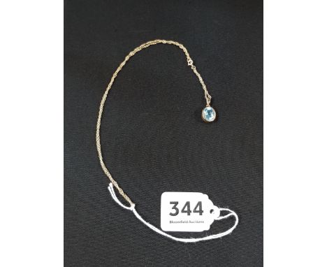 9 CARAT GOLD MOUNTED BLUE TOPAZ DROP ON 9 CARAT GOLD CHAIN 