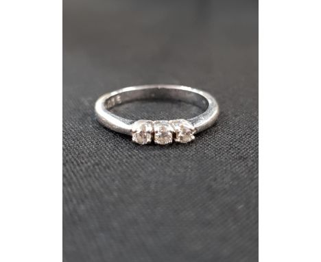 18 CARAT WHITE GOLD AND DIAMOND RING WITH CIRCA 0.15 CARAT OF DIAMONDS 