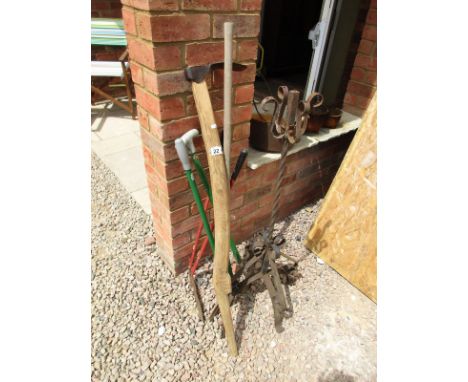 Collection of garden tools and wrought iron stand