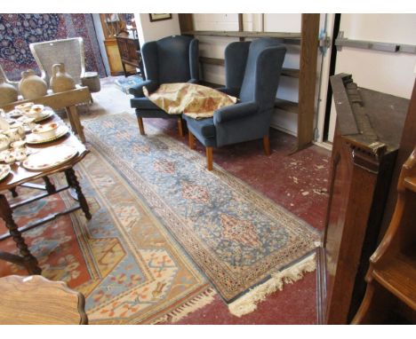 Blue runner with tapestry wall hanging