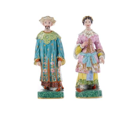 PAIR OF MID-19TH CENTURY CONTINENTAL PORCELAIN FIGURAL TAPERSTICKS,in the manner of Jacob Petit, modelled as a man and woman 