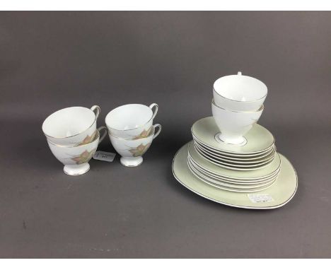 SUSIE COOPER TEA SERVICE,decorated with the 'Day Lily' pattern, comprising six trios and a cake plate