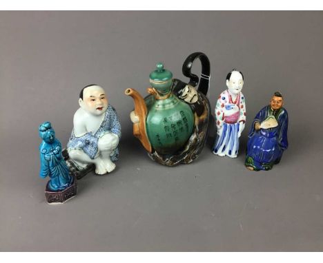 20TH CENTURY CHINESE NOVELTY TEAPOT,16.5cm high, along with four Chinese figures (5)