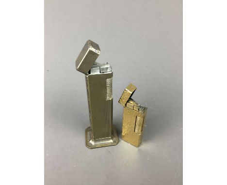 AN ART DECO  DUNHILL SILVER PLATED TALLBOY TABLE LIGHTER,11cm high, along with another Dunhill lighter (2)