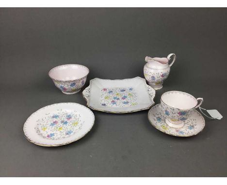 TUSCAN TEA SERVICE,transfer decorated with flowerheads and leafage, comprising 6 cups, 6 saucers, 3 side plates and a cake pl
