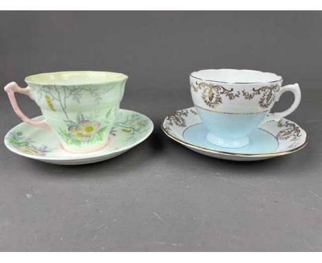 ROYAL VALE PART TEA SERVICE,with floral and gilt decoration, comprising ten cups, eleven saucers, eleven plates, one cake pla