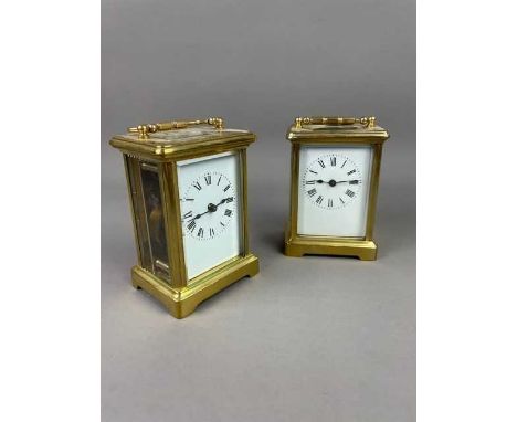 TWO BRASS CARRIAGE CLOCKS,the white enamel dials with numerals in black, 12.5cm high and 12cm highCondition report: They are 