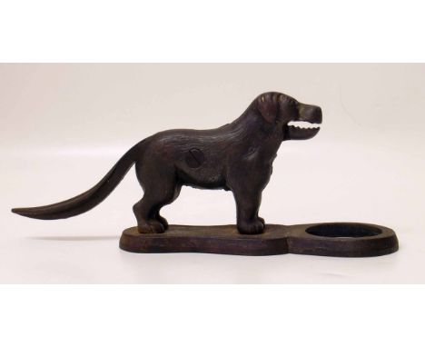 Cast iron nut cracker in the form of a dog. Condition report: See terms and conditions.    