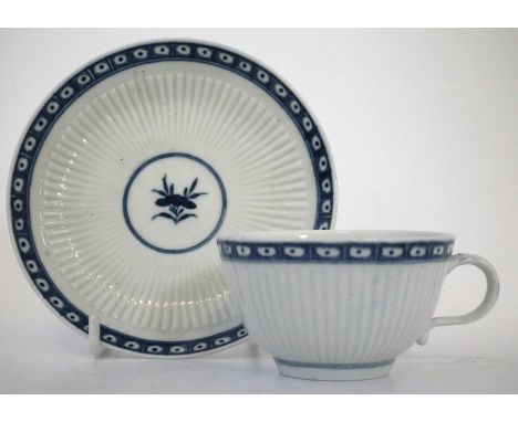 Worcester cup and saucer circa 1780   moulded with reeded bodies and painted with underglaze blue borders, crescent marks to 