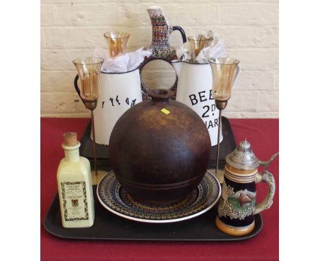 Two enamel jugs, four candle holders, hand thrown pottery vase, continental style wall plate and a water jug. Condition repor