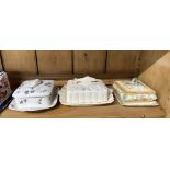 Two Staffordshire sardine dishes, both decorated with moulded fish and one butter dish.