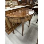19th cent. Mahogany demi lune tea table inlaid with boxwood stringing, on tapering supports.