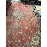 19th cent. Iranian Heriz carpet retailed by Maple & Co London (label attached). Red ground with
