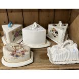 Staffordshire, five large cheese dishes all with floral decoration from various makers.
